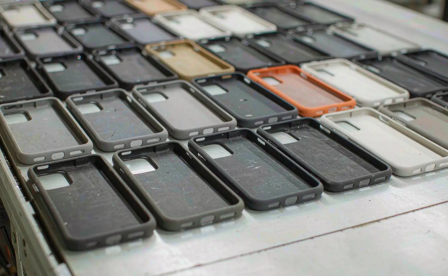 TPU soft cases: partly finished soft cases on a conveyor after the sheet is cut